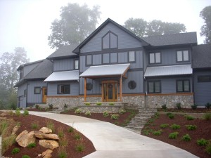 Asheville painters transformed a gray house by adding a stone walkway.