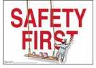 A safety first sign with a man on a swing, painted by Asheville Painting Company.
